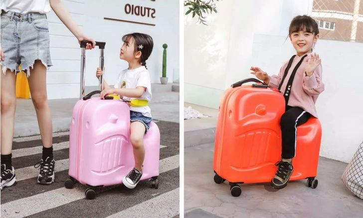 çocukların bindiği bavul